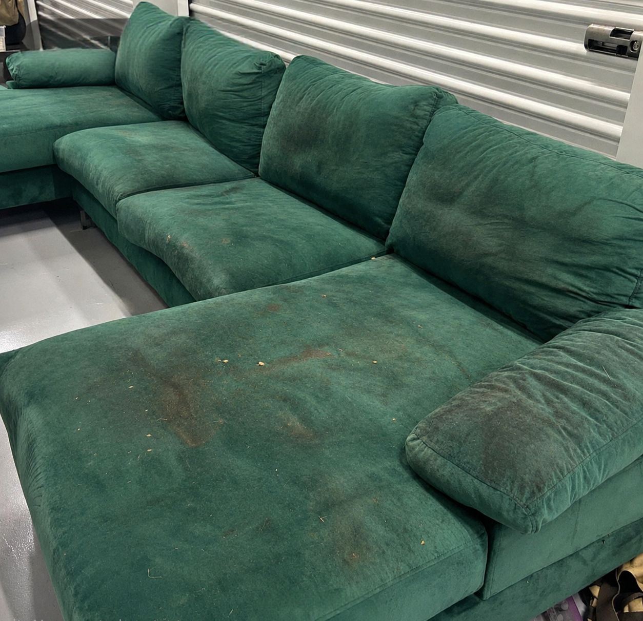 Green sectional before cleaning